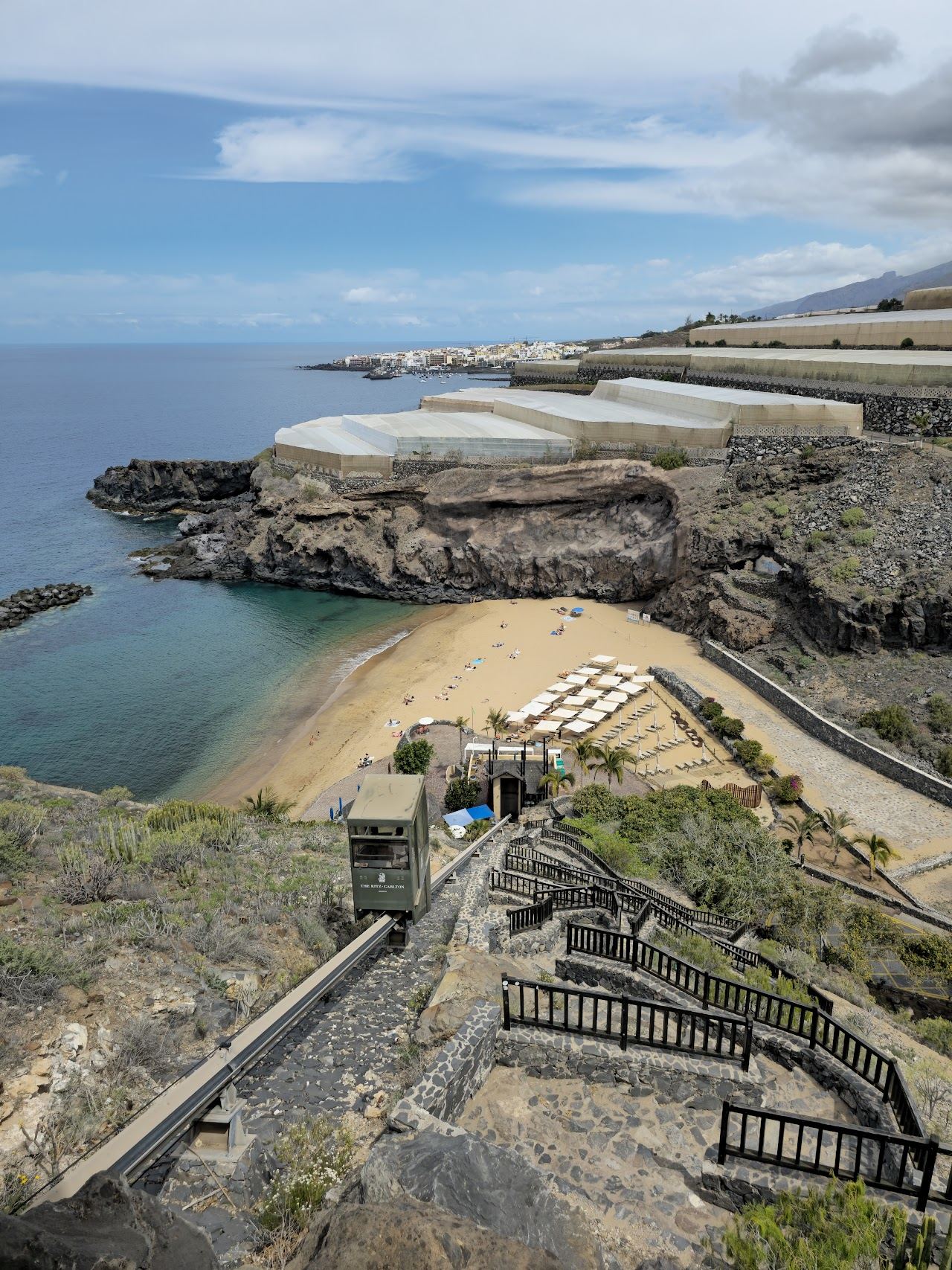 The golden sand cove of Playa de Abama below the cliffs in Guia de Isora, Tenerife