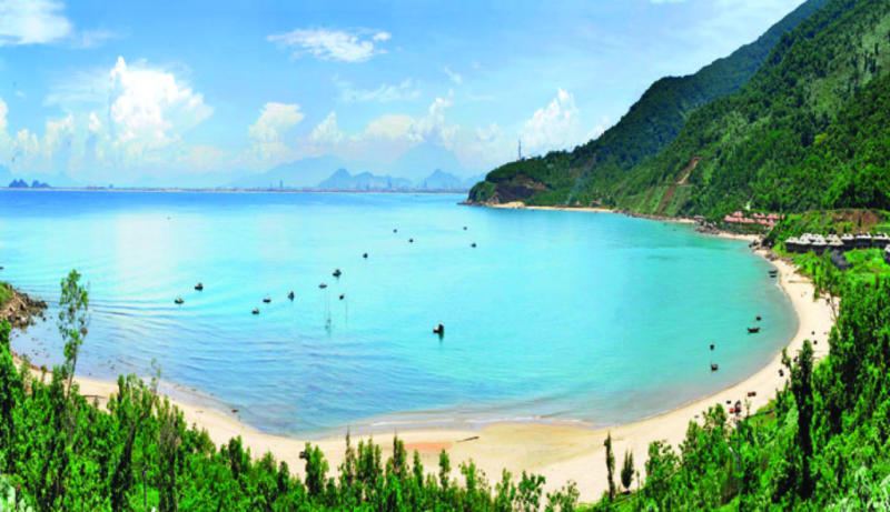 Calm clear water in the sheltered bay at Tien Sa Beach on Son Tra in Da Nang