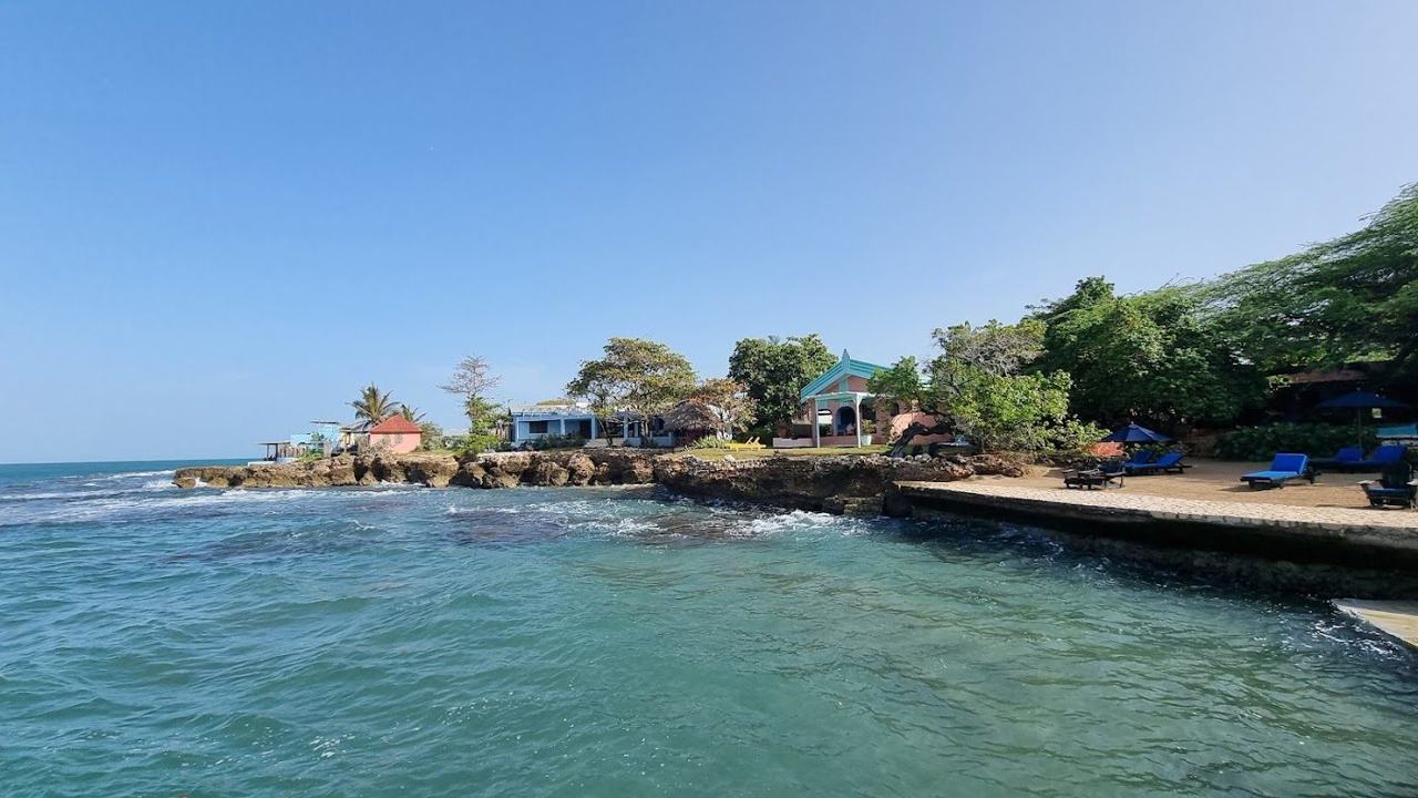 Treasure Beach Jamaica golden sand and open south coast water beside a quiet fishing village
