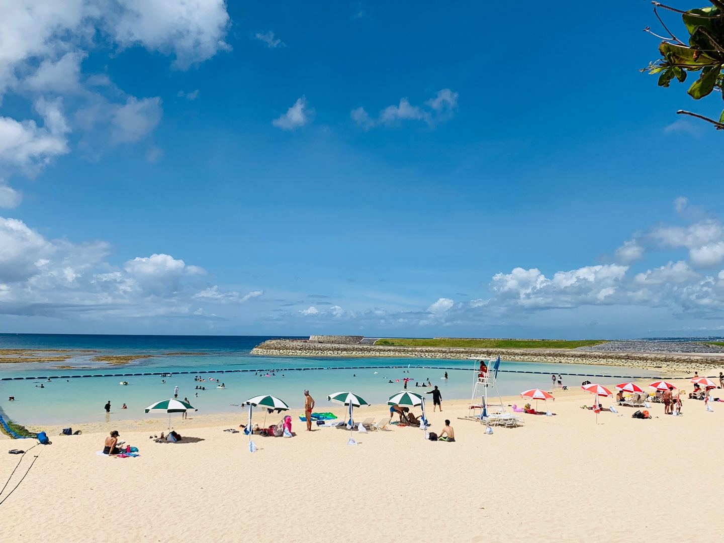 The calm man made sand and netted swim of Tropical Beach in Ginowan, Okinawa