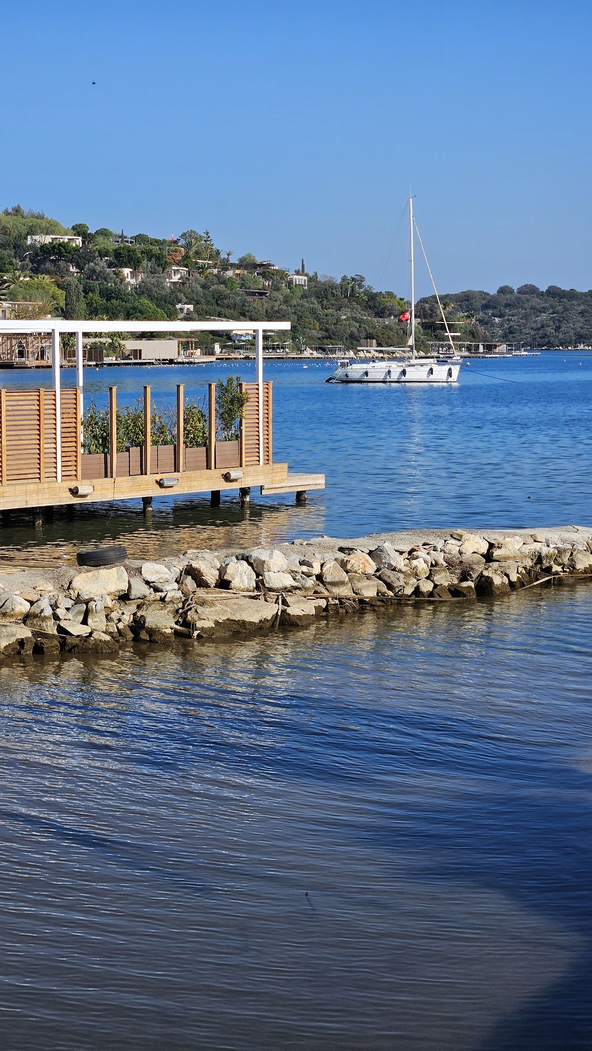 Wooden platforms over the blue bay at Golturkbuku in Bodrum