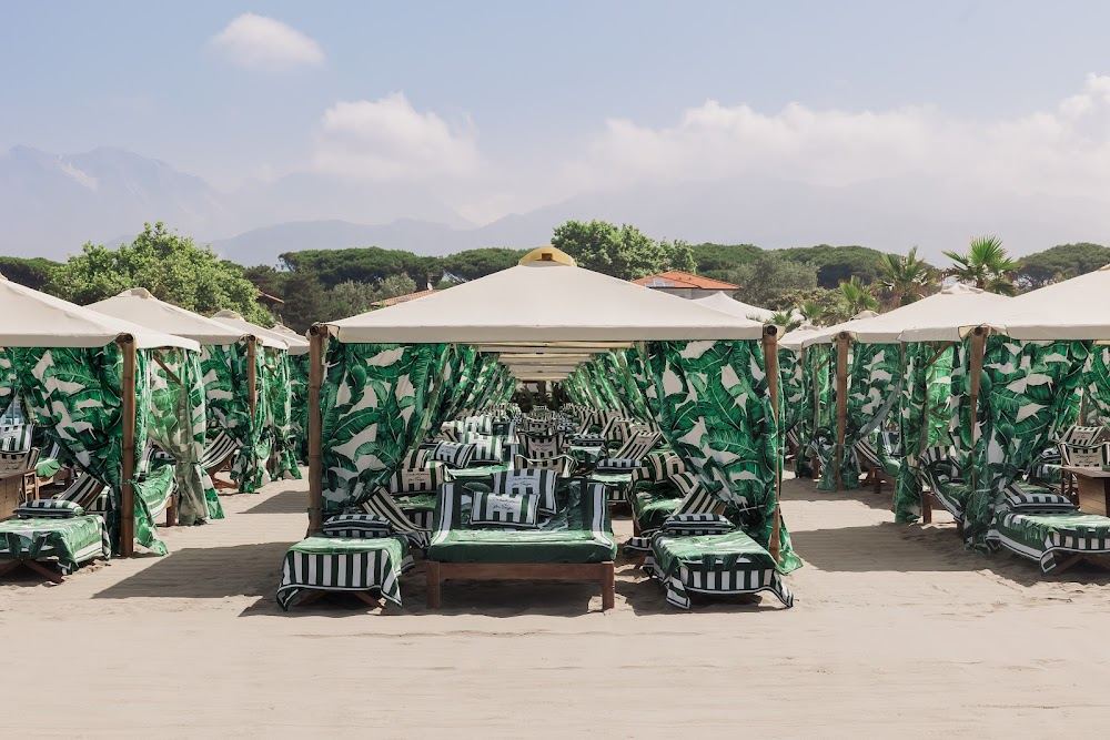 Daybeds and dining terrace at Twiga beach club on the Versilia coast