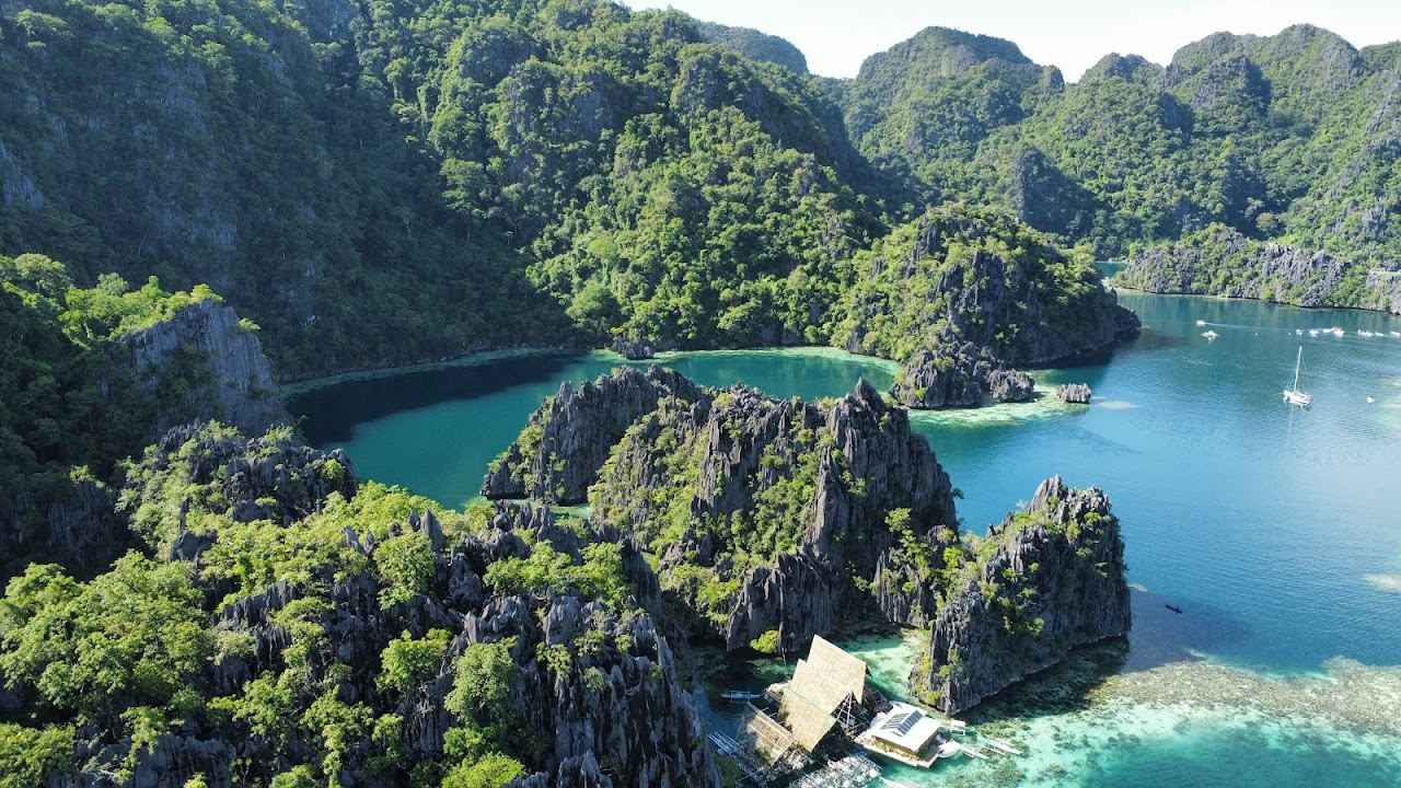 Twin Lagoon limestone cliffs and emerald water in Coron Palawan