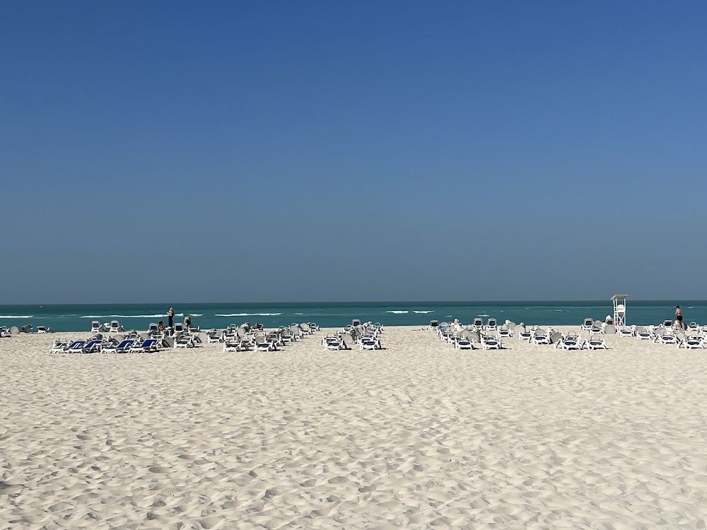 Soft white sand and calm clear Gulf water at Saadiyat Beach on Saadiyat Island