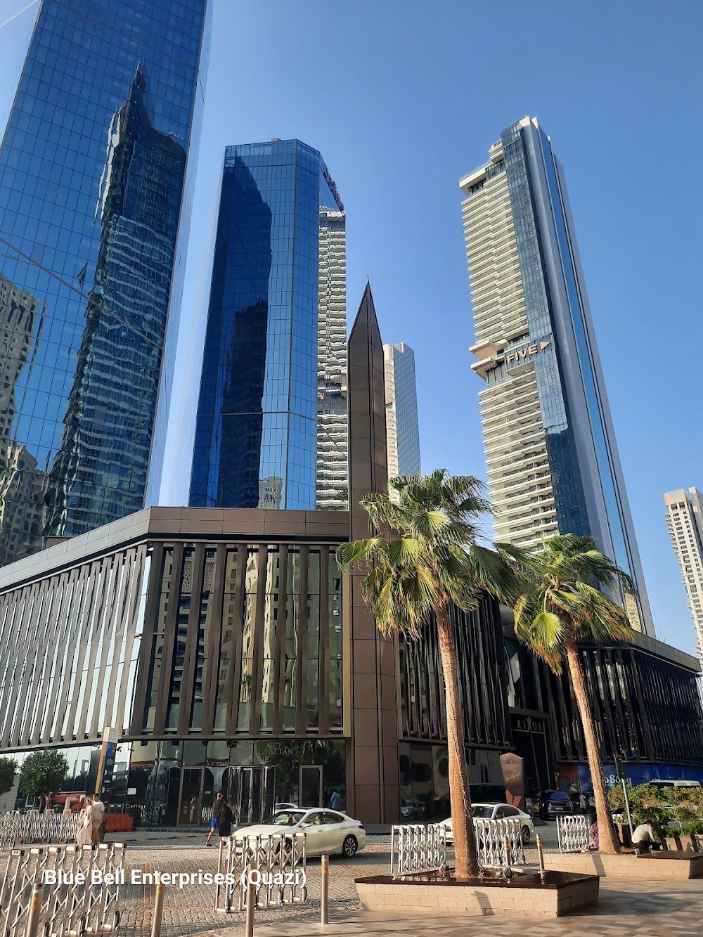 Crowded free sand backed by towers and dining at JBR Beach in Jumeirah Beach Residence, Dubai