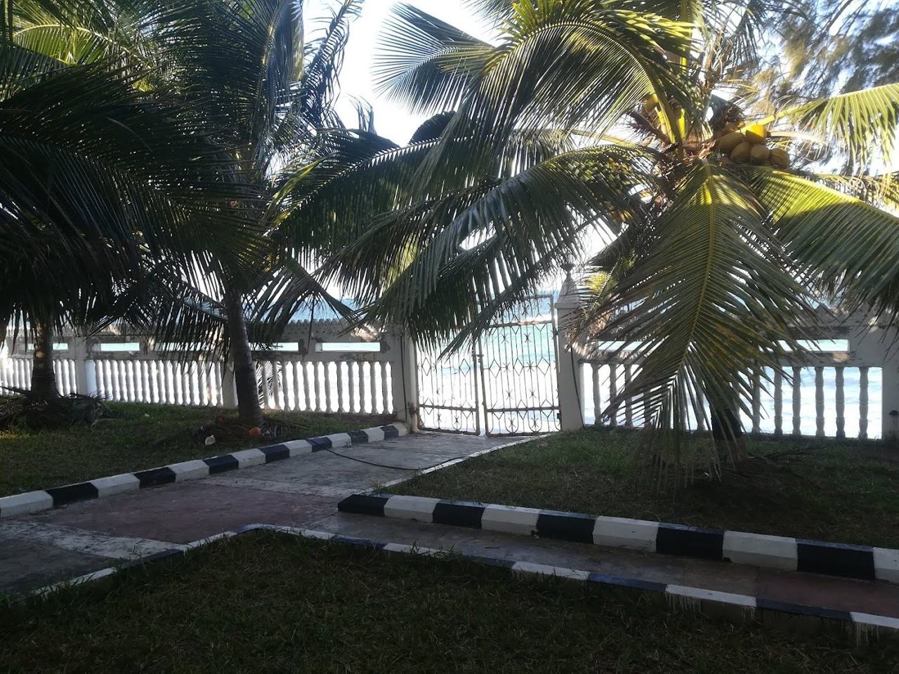 A second view of the wide white sand and shallow reef lagoon at Uroa beach on Zanzibar