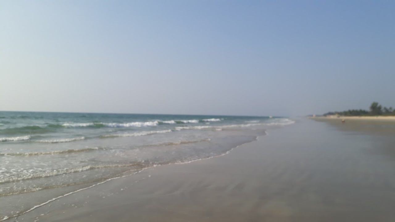 Varca Beach clean white resort sand and fishing boats in South Goa