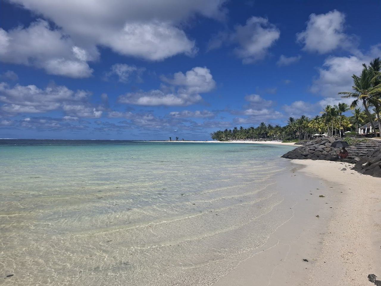 A long stretch of fine white sand and calm reef protected lagoon on the east coast.