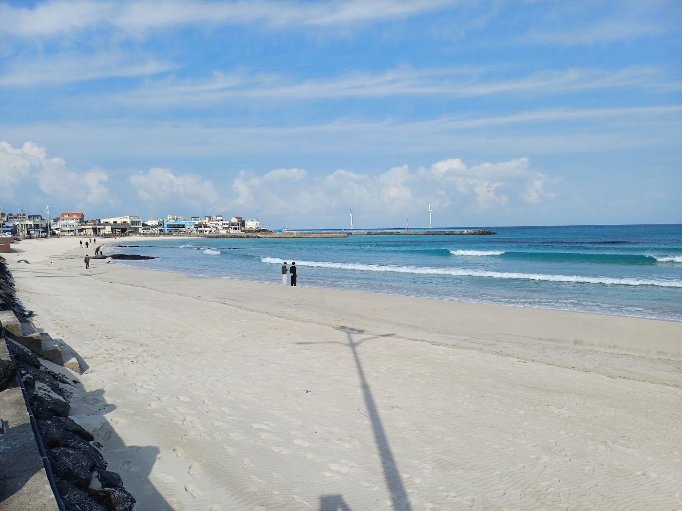 Woljeongri Beach turquoise water and cafes on the northeast coast of Jeju