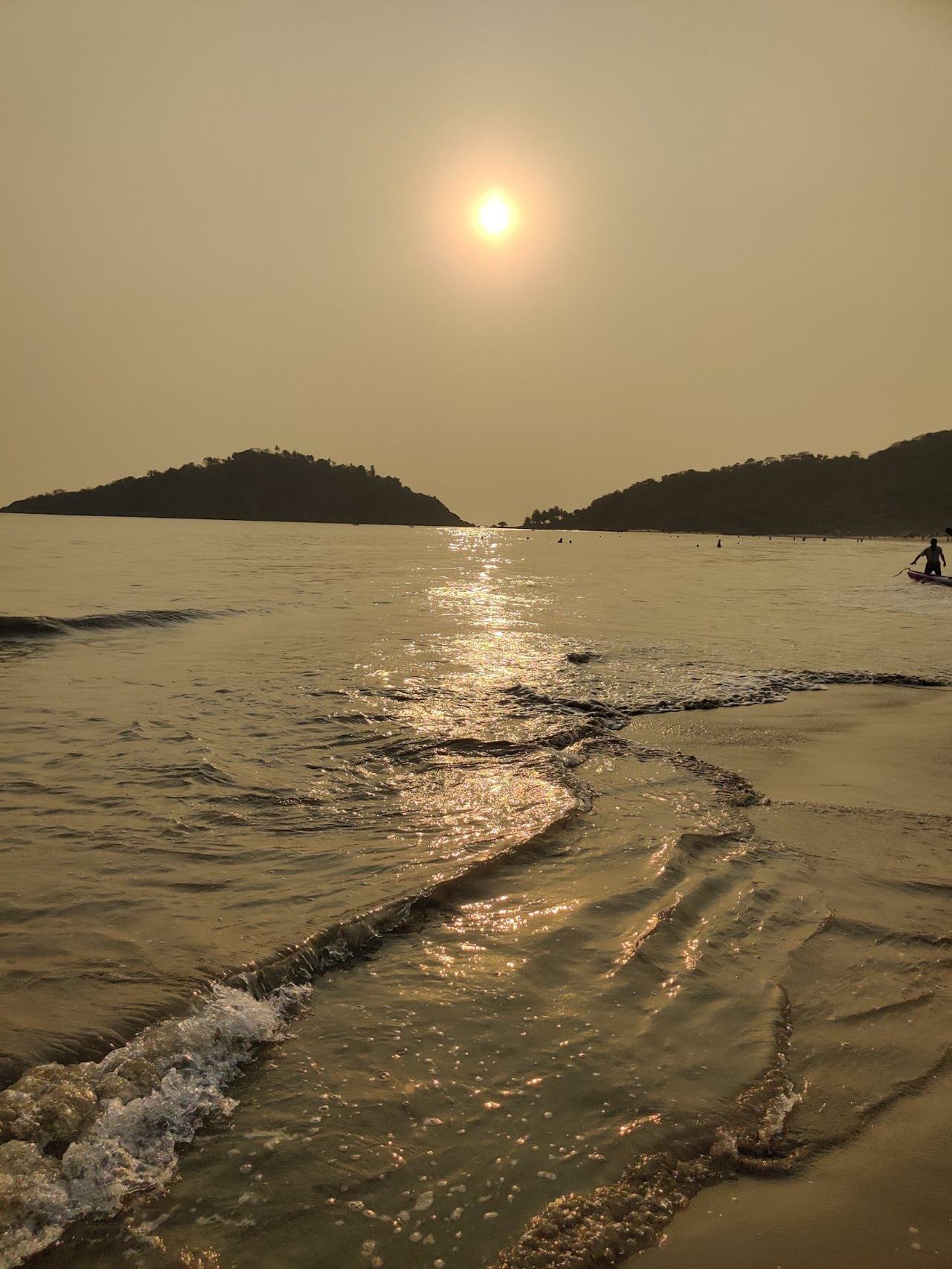 A calm warm bay fringed with palms in the quiet south of Goa