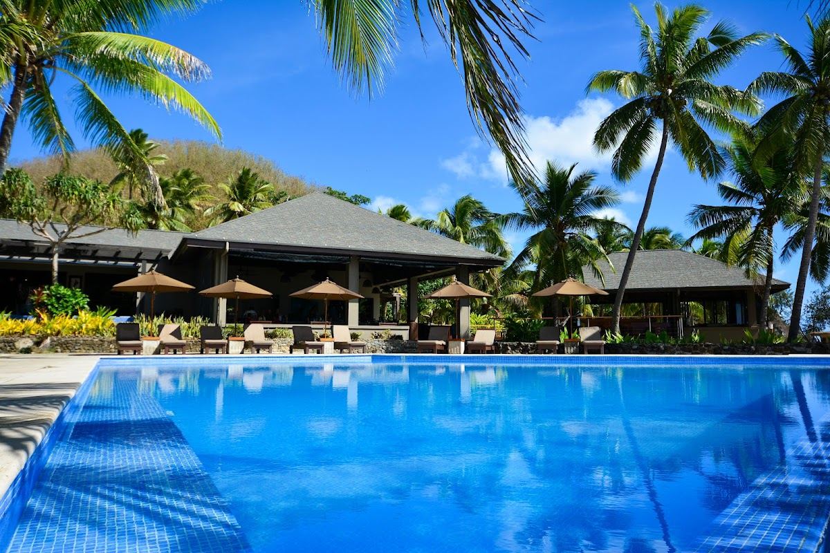 Beachfront bures and white sand at Yasawa Island Resort in the far north of Fiji