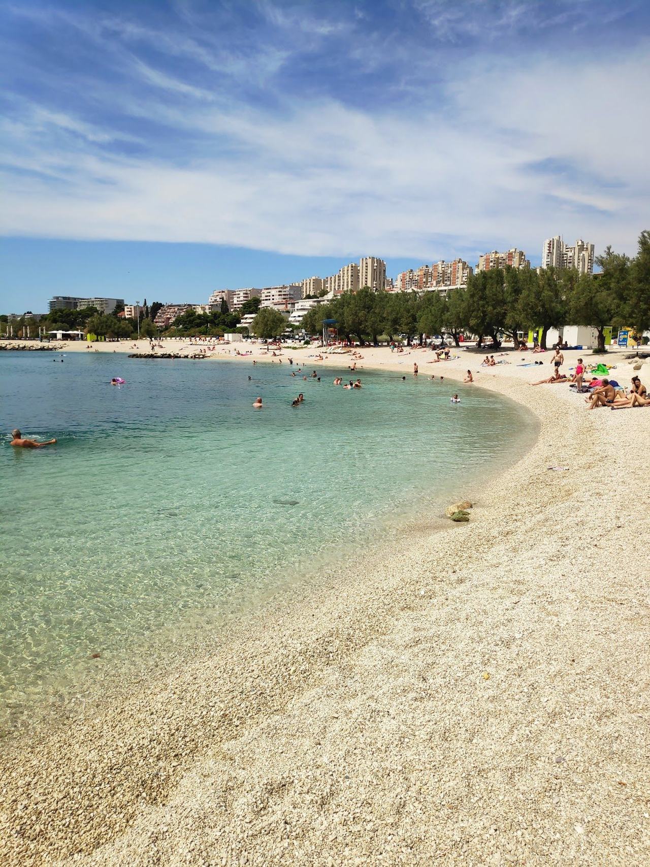 Znjan pebble beach and promenade east of the centre in Split with clear water on the Dalmatian Coast